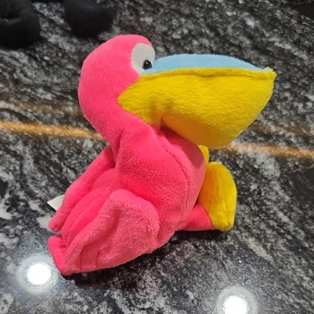 Vibrant Pink and Yellow Stuffed Bird Toy